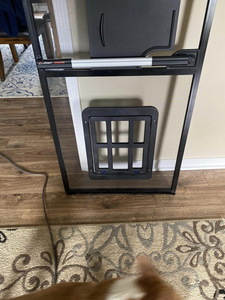 Add dog door to screen outlet door