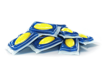 Pile of blue blister-pack tablets with yellow discs stacked on a white background